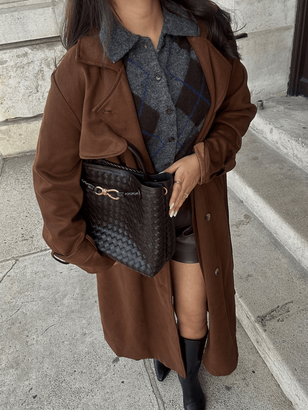 Woven Vegan Leather Handbag – Lucia Top Handle — Black, hand carrying with brown suit | BTendance